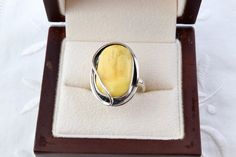 Ring made of 925 sterling silver and natural Baltic amber in yellow color. Oval yellow ring, handmade.  The ring size is 6 1/2, the inner diameter is 17 mm.  The size of the stone is 13 x 19 mm.  The weight of the ring is 6.4 g.  The condition is excellent. Vintage and antique items are sold as is. This is a unique thing from the last century. It can be a wonderful gift for a particular person or yourself.  It will also be a great addition to your collection.  If you love vintage jewelry, please Modern Yellow Ring Jewelry, Modern Yellow Ring With Polished Finish, Modern Yellow Rings With Polished Finish, Handmade Baltic Amber Ring, Handmade Baltic Amber Jewelry, Yellow Oval Cabochon Ring For Gift, Elegant Baltic Amber Rings As Gift, Elegant Baltic Amber Rings For Gifts, Elegant Yellow Oval Cabochon Ring