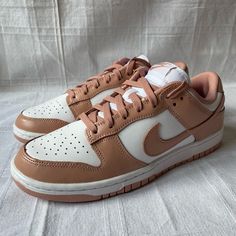 Shoes Are Brand New Without Box 100% Authentic The Nike Women’s Dunk Low ‘Rose Whisper’ Brings A Soft Color Palette To The Vintage Basketball Shoe That Debuted On The College Hardwood In 1985. The Low-Top Carries An All-Leather Upper That Combines A Clean White Base With Contrasting Overlays In A Subdued Peach Hue. A Low-Cut Padded Collar Provides A Comfortable Fit, While A Nylon Tongue And Perforated Toe Box Offer Increased Airflow. Anchoring The Retro Silhouette Is A Traditional Two-Tone Rubbe Trendy Custom Lace-up Sneakers With Gum Sole, Trendy Custom Low-top Sneakers With Gum Sole, Spring Custom Sneakers With Gum Sole And Round Toe, Trendy Cream Sneakers With Perforated Toe Box, Trendy Nike Sneakers With Boost Midsole, Nike White Sole Lace-up Skate Shoes, Trendy Nike Custom Sneakers With Round Toe, Custom Cream Sneakers With Perforated Toe Box, Cream Skate Shoes For Streetwear