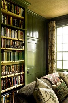 a living room filled with lots of books