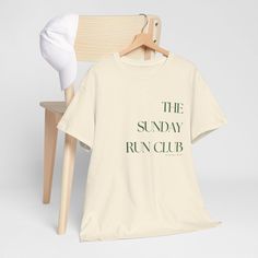 Join "The Sunday Run Club" in style with this vintage-inspired unisex t-shirt. Designed for runners, joggers, and anyone who loves to keep it casual, this retro-themed tee is both a stylish and eco-conscious choice. Whether you're running on the weekends or simply enjoying a relaxed day, this shirt brings comfort and a timeless look to your wardrobe. The minimalist typography gives a cool, classic aesthetic, ideal for those who appreciate both performance and fashion.  Perfect for anyone who enjoys running, from slow-paced runners to seasoned marathoners. 100% ethically grown US cotton  Unisex fit: Designed to suit all body types and shapes. Colors: White, Ice Grey, Black, and Natural Fabric: Durable, high-quality fabric, soft and breathable  💯 Happiness is guaranteed with our 30-day refu Marathon T-shirt, Cool T-shirt, Marathon Shirt Design, Running Funny, Sunday Workout, Funny Running, Run Club, Marathon Shirts, Running Club