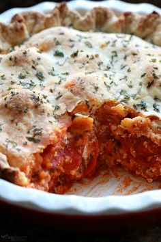 a deep dish pizza with cheese and tomato sauce