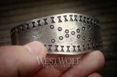 This beautiful Viking bracelet is historically accurate and modeled after a silver Viking bracelet found in the Curedale hoard at Lancashire, England in 1840. This type of stamped design was common in Viking culture, and solid silver bracelets such as this would have been used both as bullion and as jewelry. This particular bracelet we offer has been handmade of finely polished silver pewter and recreated from the archaeological find in every detail. The metal of this bracelet is completely safe Vintage Silver Jewelry For Costume Or Role-play, Medieval Style Silver Bracelet Gift, Viking Style Silver Bracelet For Gift, Viking Style Silver Bangle Bracelet, Silver Viking Bracelet Engraved, Silver Viking Necklace With Oxidized Finish, Nickel-free Viking Style Stainless Steel Jewelry, Silver Viking-style Jewelry Gift, Solid Silver Bracelets