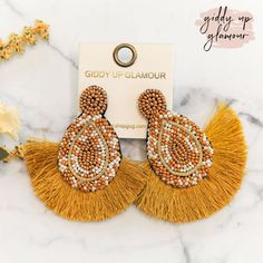 These beautiful seed bead earrings have a post back and lots of colors to make your outfit pop! The fringe trim adds a flirty touch. Earrings measure 2.75 inches long. SKU: #0926-1966 Cheap Adjustable Yellow Beaded Earrings, Summer Party Beaded Fringe Earrings, Trendy Beaded Tassel Earrings For Party, Gold Beaded Fringe Earrings For Summer, Make Your Outfit, Giddy Up Glamour, The Fringe, Early Spring Outfits, Current Fashion Trends