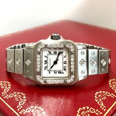 The Cartier Santos de Cartier Galbee Stainless Steel Diamond Women's Watch 24mm ~1.5ct Automatic Movement is a timeless classic. This Luxurious Cartier watch is pre-owned, in excellent condition, and comes in an original box with a full warranty from ItsHot.com. Whether you're looking for a classic timepiece or a luxurious statement piece, the  Cartier Santos de Cartier Galbee Stainless Steel Diamond Women's Watch 24mm ~1.5ct Automatic Movement is the perfect choice. Each watch can be additional Luxury Round Wedding Watches With Single Cut Diamonds, Wedding Jewelry And Watches In Platinum With Brilliant Cut, Platinum Diamond Watch With Diamond Hour Markers For Wedding, Luxury Round Diamond Watch For Weddings, White Gold Diamond Watch With Brilliant Cut For Wedding, Wedding Jewelry And Watches With Brilliant Cut Diamonds, Wedding Diamond Jewelry And Watches With Brilliant Cut, Wedding Diamond Jewelry With Brilliant Cut, Timeless Diamond White Platinum Watch