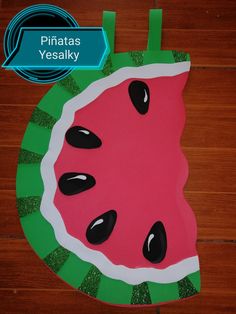 a paper plate with a piece of watermelon on it and the words pifatas yesalky above it