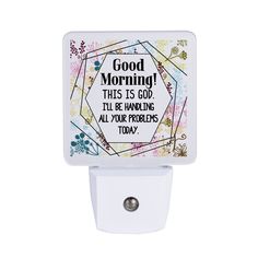 a white night light with the words good morning on it and an image of flowers