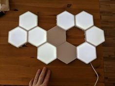 a person is working on some kind of hexagonal object that looks like hexagons