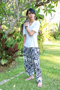 DARK BLUE ELEPHANT Harem Pants Men Comfy Bohemian Trousers for Festival Baggy Beach Summer Boho Clothes Lannaclothesdesign dark blue elephant printed harem pants with drawstring waist are handmade with rayon fabric. This ultra light weight fabric makes the harem pants super comfy to wear. They comes with comfortable elastic waist and ankles. Also drawstring in pants color. The two pockets are good size enough to fit an iPhone. These harem trousers are are perfect for relaxing at home, working ou Casual Harem Pants For Beach Festival, Casual Harem Bottoms For Vacation, Casual Harem Bottoms For Beach, Casual Harem Yoga Pants For Summer, Casual Summer Harem Yoga Pants, Bohemian Blue Pants For Vacation, White Bohemian Harem Pants For Vacation, White Bohemian Style Relaxed Fit Harem Pants, Summer Cotton Harem Pants