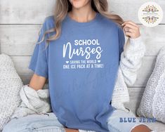 ⚠️Shipping Update⚠️ Orders placed on or after December 9th may arrive after Christmas due to high delivery demand. Please keep this in mind when placing your order. Thank you for your understanding and support! 🎄 Are you looking for School Nurse Shirt? We got you! Kick off the school year in style with our Comfort Colors® School Nurse Shirt! This is the perfect Nurse Appreciation Gift for any Back To School Nurse. With its playful design, this Funny Nursing Shirt will bring smiles and comfort t Casual Blue Tops For Back To School, Blue Letter Print Shirt For School, Blue Crew Neck Tops For Back To School, Blue Tops For College Back To School, Casual Tops With Text Print For Students, Funny Nursing, Nurse Funny, Nursing Shirt, Funny Nurse Shirts