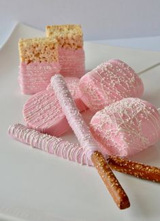 pink and white desserts are on a plate