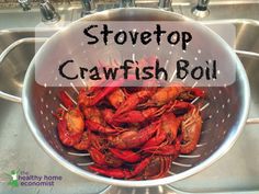 crawfish boil in a colander with the words stovetop crawfish boil