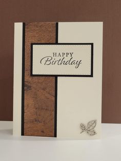 a happy birthday card with a butterfly on the front and back side, sitting on a table