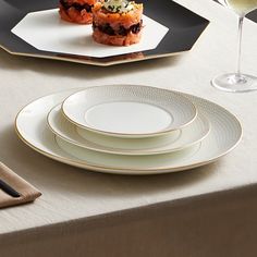 The Gio Gold collection from Wedgwood elegantly showcases your favorite culinary creations. Each piece is subtly textured with an intaglio pattern and detailed with a 22k-gold rim that brings luxurious style to the table. Made of fine bone china, the refined dinnerware cleans up easily in the dishwasher. 5-piece place setting includes dinner plate, salad plate, bread & butter plate, teacup and saucer. Made of fine bone china. Finished with hand-lined 22k-gold band. Dishwasher safe. Butter Plate, Luxury Dinnerware, Bread Butter, Teacup And Saucer, Salad Plate, Place Setting, Gold Collection, Fine Bone China, Dinnerware Set