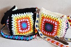 three crocheted purses sitting next to each other