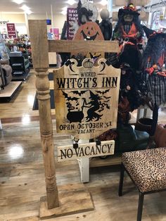 a sign that says witch's inn on it in the middle of a store