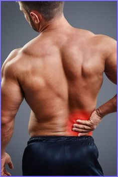 a man holding his back in pain