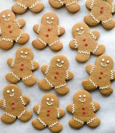 many ginger cookies with white icing and red noses