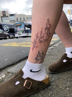 a person with a tattoo on their leg