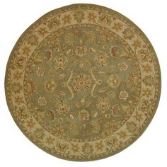 a round rug with an ornate design on the top and bottom in light green, beige and gold colors