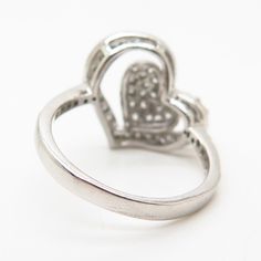 925 Sterling Silver C Z Openwork Double Heart Design Ring WELCOME TO PAWN SHOP We are an actual pawn shop and have been in business for over 25 years. Since 1990, our establishment has been serving a variety of clients by providing them with short term cash solutions and options of liquidity regarding their treasured heirlooms. Acknowledging that today′s customers are very sophisticated and are looking for a variety of investments, our acquisitions are hand-picked for our special clientele. We d Hallmarked Heart-shaped Diamond Ring, Heart-shaped Hallmark Ring For Anniversary, Heart-shaped Anniversary Ring With Hallmark, Hallmarked Heart-shaped Diamond Ring For Anniversary, Hallmarked Heart Ring For Anniversary, Heart-shaped Anniversary Rings With Hallmarks, Vintage Silver Rings For Valentine's Day, Stamped 925 Heart Ring For Anniversary On Valentine's Day, Vintage Silver Heart Ring For Valentine's Day