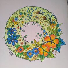 a coloring book with flowers and butterflies on it