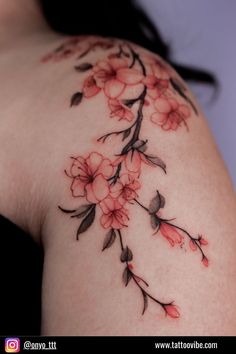 a woman's shoulder with flowers on it