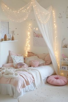 a bedroom with white walls and lights on the ceiling, pink bedding and pillows