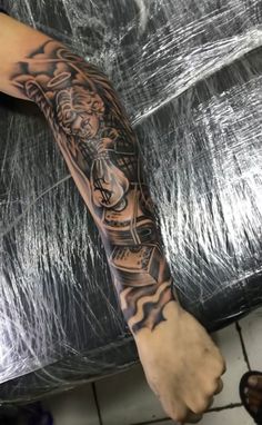 a person with a tattoo on their arm