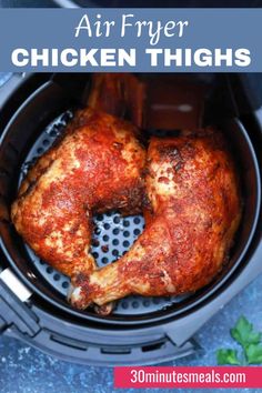 air fryer chicken thighs in an air fryer with text overlay that says air fryer chicken thighs