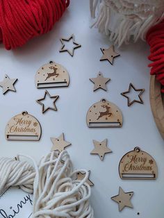 wooden christmas decorations and yarn on a table