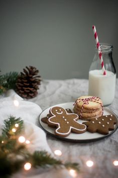 cookies and milk on a table with christmas decorations