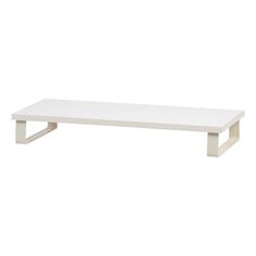 a white coffee table with metal legs