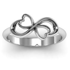 a white gold ring with an intertwined heart and the words now & forever engraved on it