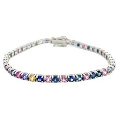 Natural Multi-color Rainbow Sapphires Tennis Bracelet The Brilliant Color Sapphires will give you a boost of joy in any moment of your life. 14k White Gold Number of Sapphires: 46 Total Sapphires Weight: 7.53 Carats Bracelet's Length: 7' inches Bracelet's Weight: 10.25 Grams 4 Prongs Setting Secure pressure clasp and double safety catch Rainbow Sapphires, Gold Number, Color Rainbow, Natural Sapphire, Tennis Bracelet, Brilliant Colors, Prong Setting, Tennis, Sapphire