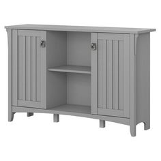 a gray cabinet with two doors and shelves