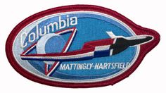 a patch with an airplane on it that says columbia, matting - harstfield