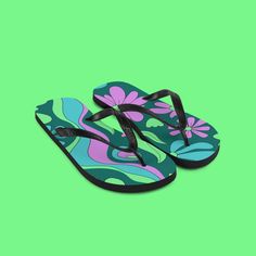 Embrace the summer vibes with these unisex flip flops featuring a stunning floral pattern set against refreshing mondegreen colors. Ideal for beach outings, garden strolls, or festival hopping, these flip flops blend comfort with the natural beauty of floral designs. Their eye-catching look makes them a perfect accessory for any relaxed or outdoor ensemble, ensuring you step out in style and comfort. Lightweight yet durable, these flip flops are essential for your summer adventures. * Rubber sole * Customizable 100% polyester fabric lining * Black Y-shaped rubber straps * Toe post style Green Non-slip Casual Flip Flops, Casual Green Non-slip Flip Flops, Retro Open Toe Sandals For Beach, Green Comfortable Flat Flip Flops, Comfortable Green Flat Flip Flops, Floral Print Sandals For Beach Season, Tropical Flip Flops For Beach Season, Trendy Floral Print Beach Sandals, Summer Floral Print Beach Sandals