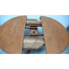 a wooden table with two wheels attached to it