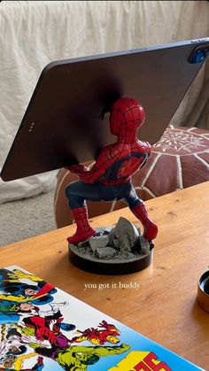 a spider - man figurine is on top of a tabletop with the caption you got it buddy