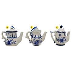 three blue and white teapots sitting next to each other