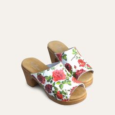 A romantic take on our open-toe mule clog. The textured white leather upper is embossed with a gorgeous floral motif. Handcrafted in Italy from premium leather, the Frida clog features a cushioned sole that flexes as you walk for all-day comfort. Pair with a floaty dress or wide-leg jeans for a dreamy look. Flexible sole with wood-like effect Heel 7,5 cm / 2.95 Inches Handmade in Italy White Cushioned Open Heel Mules, White Open Heel Mules With Cushioned Footbed, White Mules With Cushioned Footbed And Open Heel, Spring White Clogs With Removable Insole, White Open Toe Clogs With Cushioned Footbed, White High Heel Clogs For Spring, White Mules With Wooden Heel For Spring, White Wooden Heel Mules For Spring, High Heel Clogs With Cork-bed Midsoles