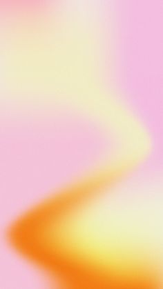 a blurry image of an orange and pink background