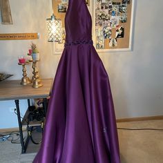 A Long Purple Dress With A Beautiful Opened Back! Elegant Purple A-line Maxi Dress, Elegant Purple A-line Gown, Purple Dress With Fitted Bodice For Homecoming, Elegant Purple Evening Dress For Homecoming, Purple Floor-length Dress For Homecoming, Purple A-line Evening Dress For Formal Occasions, Elegant A-line Purple Maxi Dress, Purple A-line Formal Gown, Purple A-line Gown For Formal Occasions