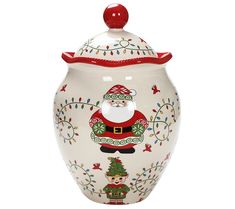 a ceramic jar with a santa clause design on the front and bottom, decorated with christmas decorations