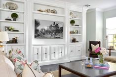 a living room filled with furniture and white walls