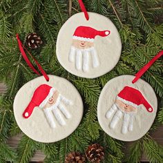 three ornaments hanging from a christmas tree