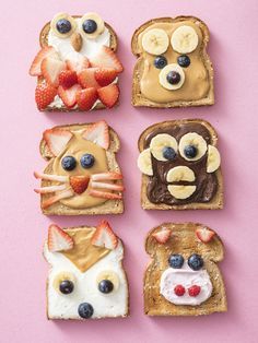 four slices of toast with fruit, peanut butter and other toppings on them are arranged in the shape of animals