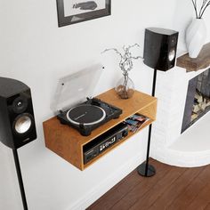 a record player is sitting on top of a shelf