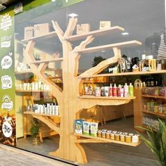 a store window with shelves and bottles in it