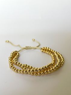 • Bracelet triple
 • bracelet en or
 • Ajustable Gold Bead Bracelets, Bracelet Gold, Gold Gold, Gold Beads, Beaded Bracelet, Gold Bracelet, Beaded Bracelets, Bracelet, Gold